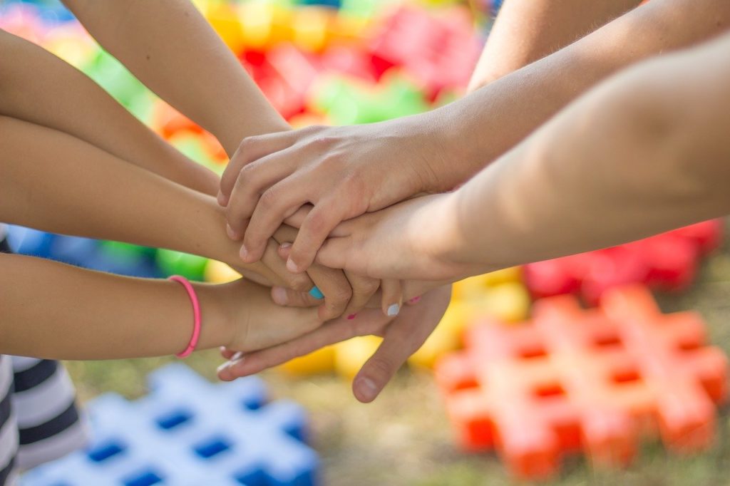Urgent private tuition requests: photograph of children holding hands.